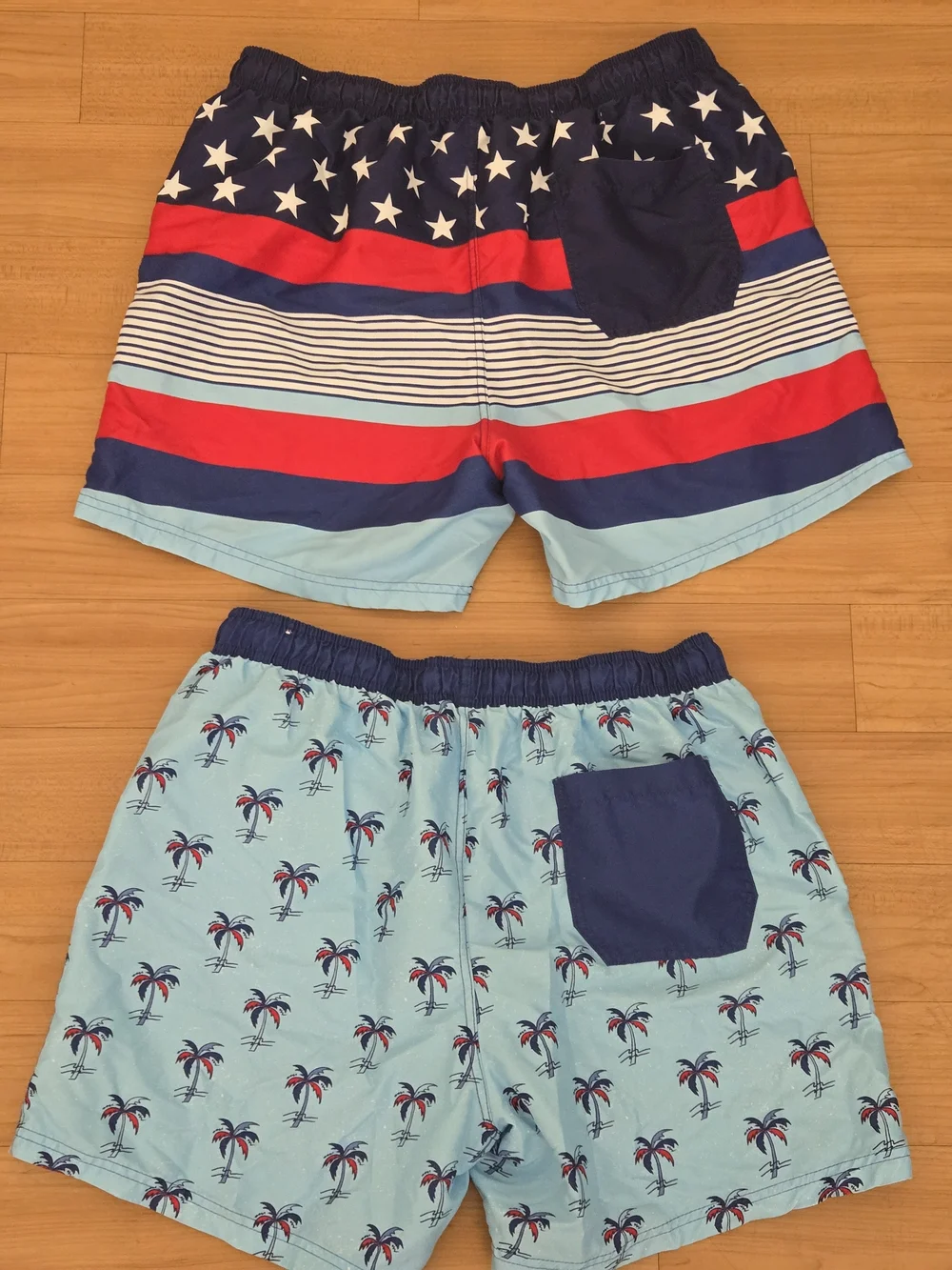 2 Pairs Boys Large Light Blue Palm Print Swim Shorts with Navy & Red Accents